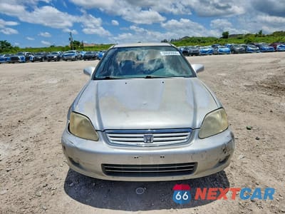 Piąte zdjęcie samochodu w środku: 1999 HONDA CIVIC LX VIN:1HGEJ6670XL015490 - miniatura