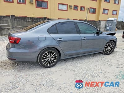 Trzecie zdjęcie samochodu z tyłu: 2016 VOLKSWAGEN JETTA SPORT VIN:3VWD17AJ1GM300259 - miniatura