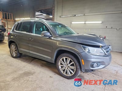 Czwarte zdjęcie samochodu z boku: 2014 VOLKSWAGEN TIGUAN S VIN:WVGAV3AX4EW616514 - miniatura