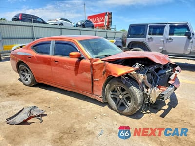Czwarte zdjęcie samochodu z boku: 2006 DODGE CHARGER R VIN:2B3KA53H46H195076 - miniatura