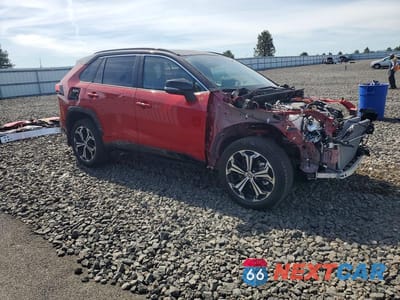 Czwarte zdjęcie samochodu z boku: 2024 TOYOTA RAV4 PRIME XSE VIN:JTMFB3FVXRD228750 - miniatura