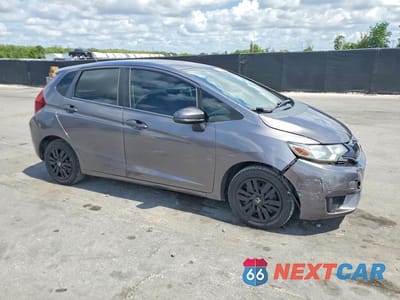 Czwarte zdjęcie samochodu z boku: 2015 HONDA FIT LX VIN:3HGGK5H57FM759127 - miniatura