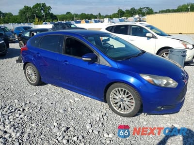 Czwarte zdjęcie samochodu z boku: 2014 FORD FOCUS ST VIN:1FADP3L98EL422599 - miniatura