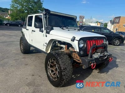 Czwarte zdjęcie samochodu z boku: 2014 JEEP WRANGLER UNLIMITED SPORT VIN:1C4BJWDG7EL203909 - miniatura