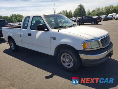 Czwarte zdjęcie samochodu z boku: 2002 FORD F-150 VIN:1FTRX17W02NB82565 - miniatura