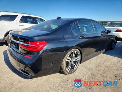 Trzecie zdjęcie samochodu z tyłu: 2018 BMW 750 I VIN:WBA7F0C54JGM22962 - miniatura