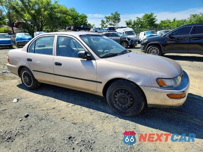 Czwarte zdjęcie samochodu z boku: 1997 TOYOTA COROLLA BASE VIN:2T1BA02EXVC176906 - miniatura