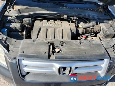 Zdjęcie 12 z 13 samochodu: 2006 HONDA PILOT EX VIN:2HKYF18726H558954 - miniatura