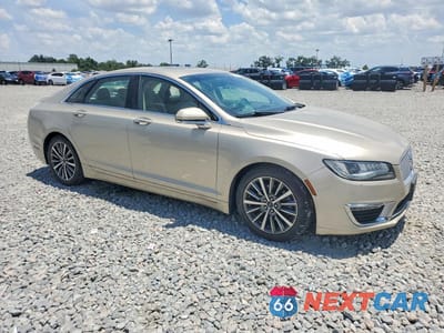 Czwarte zdjęcie samochodu z boku: 2017 LINCOLN MKZ SELECT VIN:3LN6L5C91HR647927 - miniatura