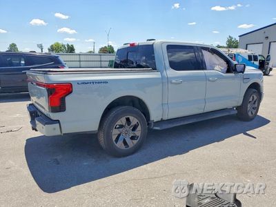 Trzecie zdjęcie samochodu z tyłu: 2023 FORD F150 LIGHTNING PRO VIN:1FT6W1EV7PWG45058 - miniatura