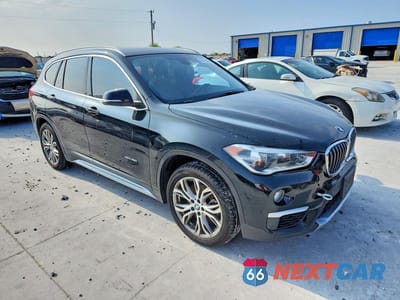 Czwarte zdjęcie samochodu z boku: 2017 BMW X1 XDRIVE28I VIN:WBXHT3Z30H4A53655 - miniatura
