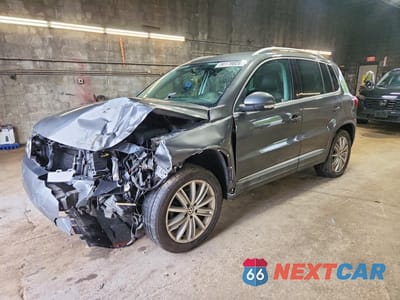 2014 VOLKSWAGEN TIGUAN S WVGAV3AX4EW616514 - główne zdjęcie licytacji z USA - miniatura