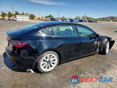 Trzecie zdjęcie samochodu z tyłu: 2022 TESLA MODEL 3 VIN:5YJ3E1EA4NF286594 - miniatura