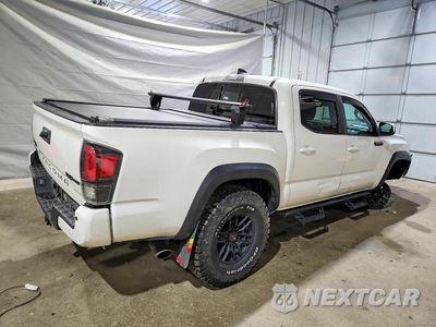 Trzecie zdjęcie samochodu z tyłu: 2021 TOYOTA TACOMA TRD PRO VIN:5TFCZ5AN1MX258387 - miniatura