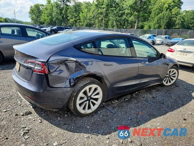 Trzecie zdjęcie samochodu z tyłu: 2023 TESLA MODEL 3 VIN:5YJ3E1EA7PF438354 - miniatura