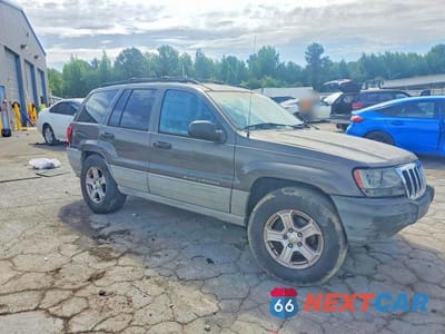 Czwarte zdjęcie samochodu z boku: 2000 JEEP GRAND CHEROKEE LAREDO VIN:1J4G248S2YC399844 - miniatura
