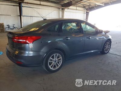 Trzecie zdjęcie samochodu z tyłu: 2018 FORD FOCUS SE VIN:1FADP3FEXJL205204 - miniatura