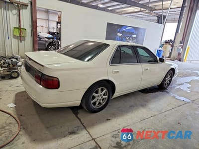 Trzecie zdjęcie samochodu z tyłu: 1999 CADILLAC SEVILLE STS VIN:1G6KY5498XU941225 - miniatura