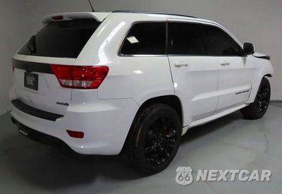 Trzecie zdjęcie samochodu z tyłu: 2013 JEEP GRAND CHEROKEE SRT-8 VIN:1C4RJFDJ4DC563714 - miniatura
