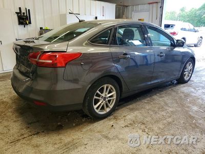 Trzecie zdjęcie samochodu z tyłu: 2016 FORD FOCUS SE VIN:1FADP3F25GL365831 - miniatura