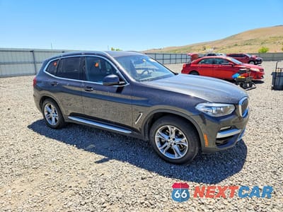 Czwarte zdjęcie samochodu z boku: 2021 BMW X3 XDRIVE30E VIN:5UXTS1C04M9G84191 - miniatura