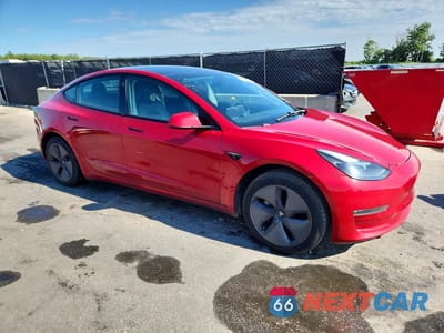 Czwarte zdjęcie samochodu z boku: 2021 TESLA MODEL 3 VIN:5YJ3E1EBXMF902886 - miniatura