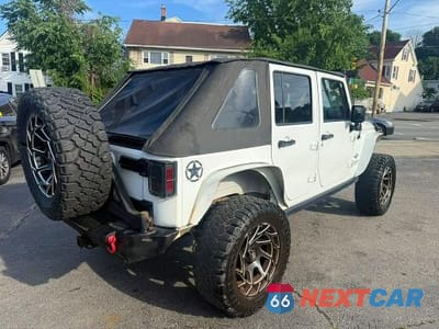 Trzecie zdjęcie samochodu z tyłu: 2014 JEEP WRANGLER UNLIMITED SPORT VIN:1C4BJWDG7EL203909 - miniatura