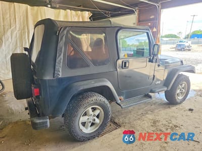 Trzecie zdjęcie samochodu z tyłu: 1999 JEEP WRANGLER / TJ SE VIN:1J4FY29P3XP466242 - miniatura