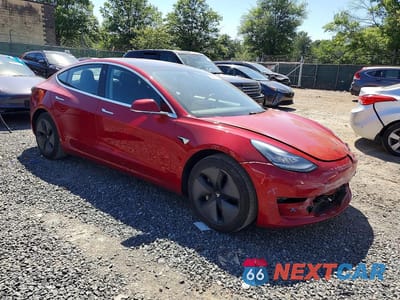 Czwarte zdjęcie samochodu z boku: 2018 TESLA MODEL 3 VIN:5YJ3E1EA0JF040717 - miniatura