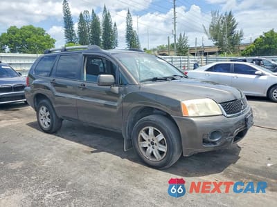 Czwarte zdjęcie samochodu z boku: 2011 MITSUBISHI ENDEAVOR LS VIN:4A4JN2AS8BE035899 - miniatura