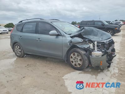 Czwarte zdjęcie samochodu z boku: 2010 HYUNDAI ELANTRA TOURING GLS VIN:KMHDC8AEXAU074047 - miniatura