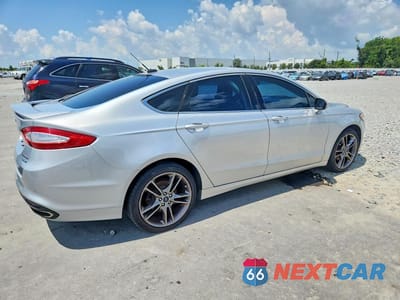 Trzecie zdjęcie samochodu z tyłu: 2016 FORD FUSION TITANIUM VIN:3FA6P0K9XGR211630 - miniatura