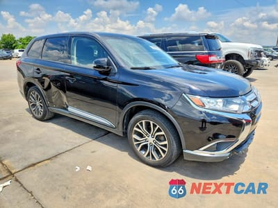 Czwarte zdjęcie samochodu z boku: 2016 MITSUBISHI OUTLANDER SE VIN:JA4AD3A38GZ011797 - miniatura