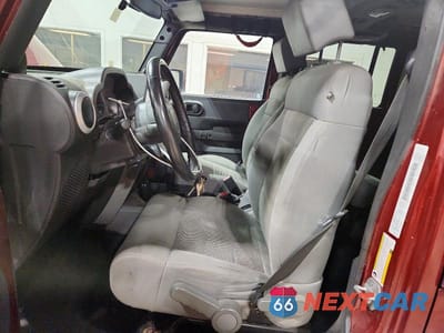 Zdjęcie 7 z 13 samochodu: 2009 JEEP WRANGLER UNLIMITED SAHARA VIN:1J4GA591X9L759460 - miniatura