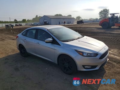 Czwarte zdjęcie samochodu z boku: 2016 FORD FOCUS SE VIN:1FADP3F22GL224747 - miniatura