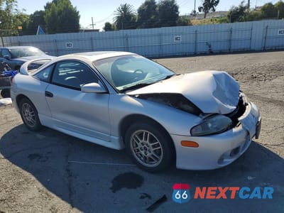 Czwarte zdjęcie samochodu z boku: 1999 MITSUBISHI ECLIPSE GS VIN:4A3AK44Y4XE056507 - miniatura