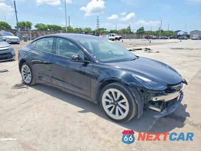 Czwarte zdjęcie samochodu z boku: 2022 TESLA MODEL 3 VIN:5YJ3E1EA4NF369667 - miniatura