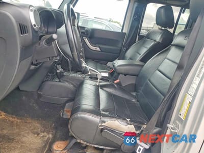 Zdjęcie 7 z 13 samochodu: 2012 JEEP WRANGLER UNLIMITED SAHARA VIN:1C4BJWEG7CL150012 - miniatura