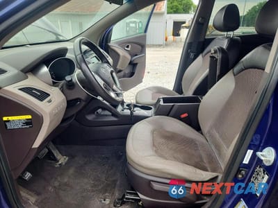 Zdjęcie 7 z 13 samochodu: 2013 HYUNDAI TUCSON VIN:KM8JUCAC5DU696349 - miniatura