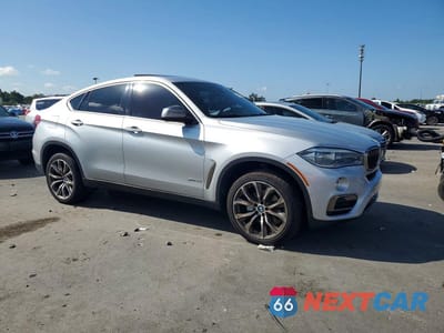Czwarte zdjęcie samochodu z boku: 2018 BMW X6 SDRIVE35I VIN:5UXKU0C51J0G80773 - miniatura