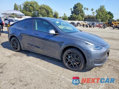 Czwarte zdjęcie samochodu z boku: 2022 TESLA MODEL Y VIN:7SAYGDEE6NA020725 - miniatura
