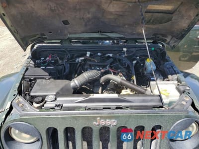 Zdjęcie 12 z 13 samochodu: 2009 JEEP WRANGLER UNLIMITED SAHARA VIN:1J4GA59159L733168 - miniatura
