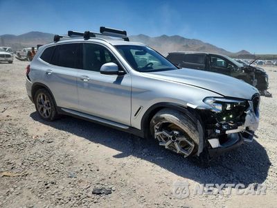 Czwarte zdjęcie samochodu z boku: 2021 BMW X3 XDRIVE30E VIN:5UXTS1C03M9G40795 - miniatura