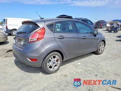 Trzecie zdjęcie samochodu z tyłu: 2014 FORD FIESTA SE VIN:3FADP4EJ9EM121626 - miniatura