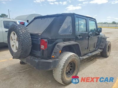 Trzecie zdjęcie samochodu z tyłu: 2010 JEEP WRANGLER UNLIMITED SAHARA VIN:1J4HA5H13AL198349 - miniatura