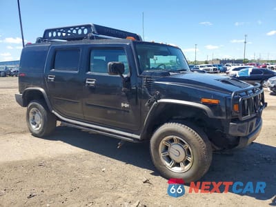 Czwarte zdjęcie samochodu z boku: 2004 HUMMER H2 VIN:5GRGN23UX4H103393 - miniatura