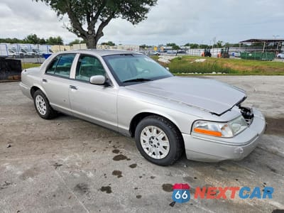 Czwarte zdjęcie samochodu z boku: 2005 MERCURY GRAND MARQUIS GS VIN:2MEFM74WX5X620982 - miniatura