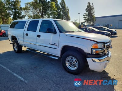 Czwarte zdjęcie samochodu z boku: 2004 GMC SIERRA VIN:1GTHK232X4F214597 - miniatura