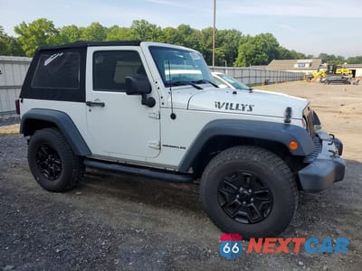 Czwarte zdjęcie samochodu z boku: 2016 JEEP WRANGLER SPORT VIN:1C4AJWAG8GL167506 - miniatura