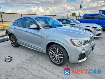 Czwarte zdjęcie samochodu z boku: 2016 BMW X4 XDRIVE28I VIN:5UXXW3C55G0M89588 - miniatura